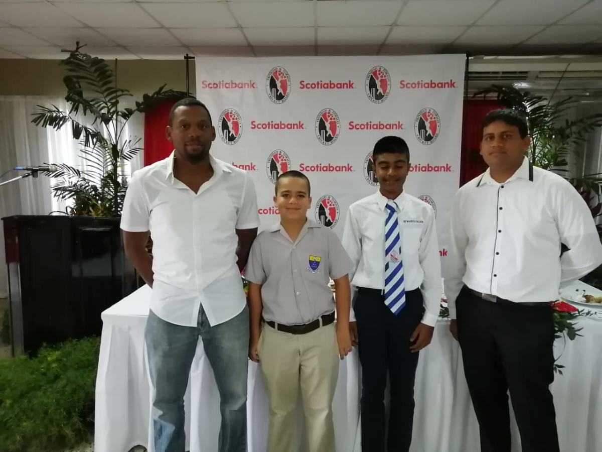 Scotiabank NexGen U15 launch 2020 at the National Cricket Centre, Couva. Manager Dwayne Bourne and Coach Aaron Kurbanali pose with Captain Arshad Harrilal and Vice-Captain Niall Maingot.